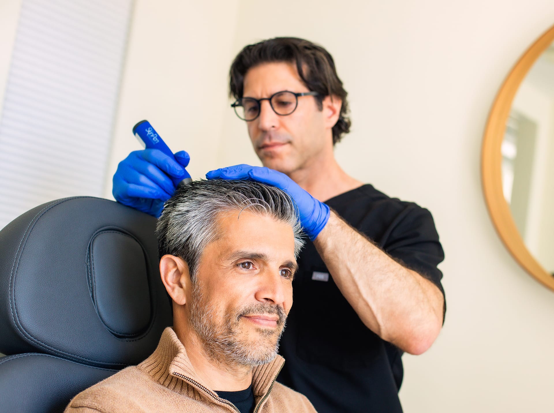 man getting a hair restoration treatment