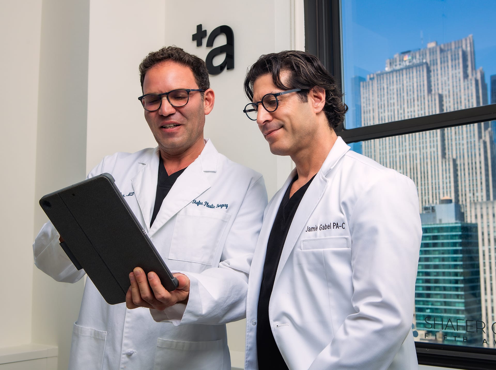 doctors looking at an ipad